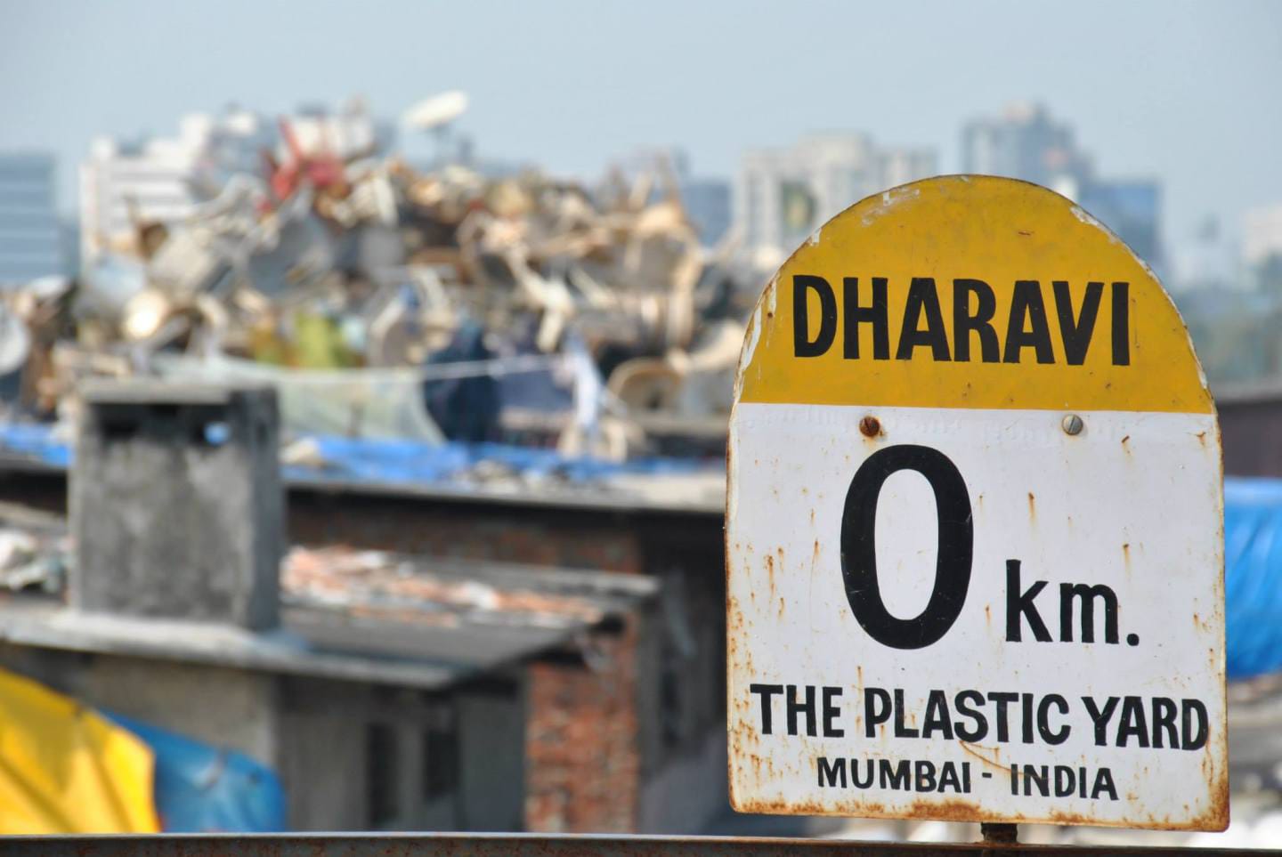 Roadside marker at the entrance to Dharavi's plastic recycling yard, Mumbai