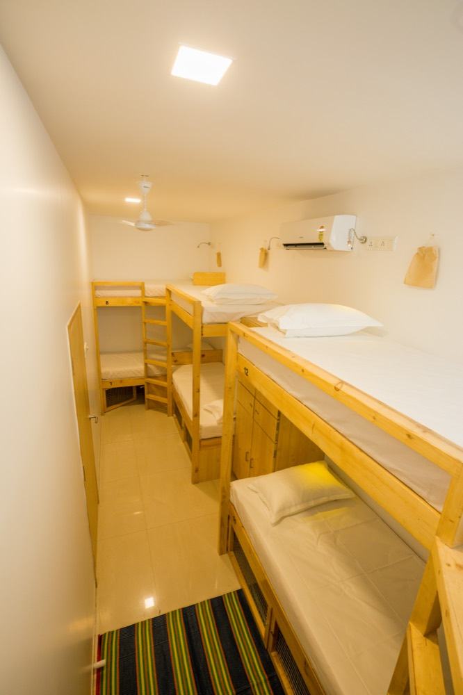 6-Bed Mixed Dorm with air conditioning and wooden bunks